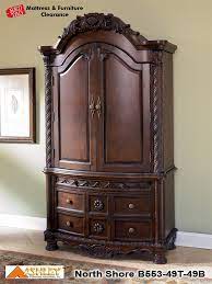 562 99 Millennium By Ashley North Shore Armoire Base B553 49b A Rich Traditional Design And Exquisite Details Come To Armoire Shore Bedroom Bedroom Armoire