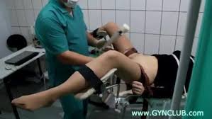 A gynecological chair in the background. The Gynecologist Drops Into Action With Elena Muff Pussy Examination Internal Mobileporn