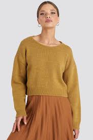 This seamless sweater knit in the round with a great craft store yarn, lion brand thick and quick, is a super affordable option if you are a bit timid about the if i was wearing this nolita sweater from we are knitters, i would want to give myself a hug, too! Cropped Round Neck Knitted Sweater Yellow Na Kd Com