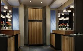 The cabinet has four adjustable glass display shelves and interior recessed lighting. Zebrawood Kitchen Cabinets Gilmans