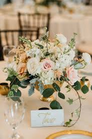 Floral Center Arrangement With Blush Ivory Gold And Greenery Accents Florist Enchantedfloristtn Photo Wedding Floral Centerpieces Wedding Floral Wedding