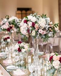 Pops Of Red Completed This Romantic Look As The Mirrored Table Highlighte Wedding Floral Centerpieces Beach Wedding Flowers Beach Wedding Decorations Reception