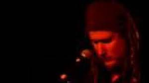 Andrew Winton playing acoustic lap guitar (lucky boy)