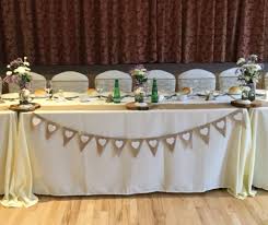 Rustic Wedding With A Top Table Decorated With Ivory Table Cloths Ivory Chair Covers Table Decorations Rustic Wedding Bouquet Burlap Rustic Wedding Backdrops