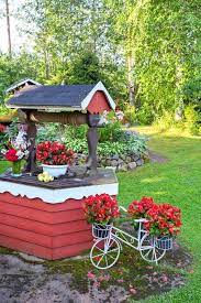 samin rakentaman kellolla varustetun kaivonkannen edustalla kukkivat annansilmabegoniat outdoor decor bird bath bird house