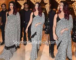 This aishwarya rai photo might contain cocktail dress, sheath, dinner dress, dinner gown, formal, and evening gown. Aishwarya Rai In A Black And White Saree South India Fashion