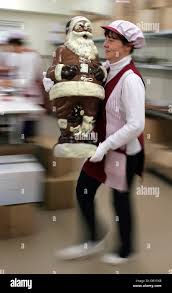 Sylvia Schulz of confectionary Felicitas Ltd. trasports a giant chocolate  Santa in Hornow, Germany, 02 November 2007. Christmas poduction of the  family business employing 45 people is running as scheduled to have