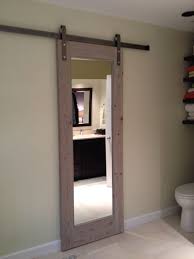Sliding glass doors open up. Sliding Bathroom Door Gray Toned Antique Wood Sliding Bathroom Doors Bathroom Barn Door Interior Barn Doors