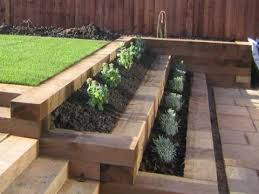 A retaining wall is a structure that retains any material (usual earth) and prevents it from slipping or falling some retaining walls are not able to sustain high pressure from the soil such as brick walls, often retaining walls can attract termites to your property when wood is used as a retaining wall. Indoor Outdoor Diy Pallet Ideas Vertical Hanging Metal Wooden Succulent Garden Ceramic Farmhouse Retaining Orchid Galvanize Garden Retaining Wall Garden Sloped Garden