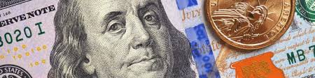American Money Close-up. 100 Dollar Banknote and 1 Dollar Coin. Benjamin  Franklin and Statue of Liberty Stock Photo