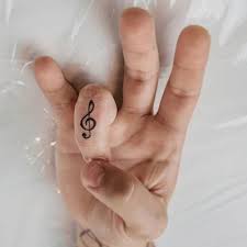 Finger tattoo that can easily attract everybody are birds heart cross anchor infinity and many. Small Hand Music Tattoo Designs For Men Tattoo Designs Ideas