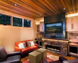 So the correct advice is to keep the tv as close to eye level (when seated) as possible, which will generally mean as low on the wall as possible. I Like The Low Wide Fireplace Below A Tv Rustic Living Room Design Contemporary Family Rooms Modern Rustic Decor Living Room