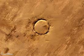 Deep In The Sahara Desert Lies A Meteor Impact Crater That Is Nearly A Perfect Circle Tenoumer Crater Is 1 9 Kilometers Impact Crater Crater Earth From Space