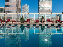 A Room With A View Is Nice But How About A Pool With A View These Hotels Have Rooftop Pools With Stunning Scenic Views Hotel Pool Boston Hotels Denver Hotels