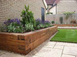 Modern garden designs give a lot of freedom to creativity. Raised Herb Bed I Like That This Can Be Easily Incorporated On A Deck Too Wooden Garden Edging Backyard Landscaping Backyard