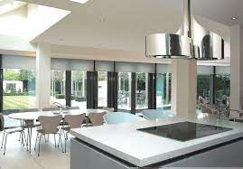 The mosaic tile backsplash behind the stove top is the final touch needed for this contemporary vintage kitchen. Love The Island Extractor Fan Diseno De Cocina Cocina Atemporal Islas De Cocina