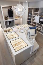 Symmetrical design with closet island jewelry display as focal point. Luxury Bespoke Fitted Wardrobes Schmalenbach Closets
