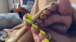 Sultry Sultana footjob under blanket