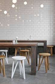 Subway Tiles Concrete Floor Simple Lighting A Long Family Style Table Restaurant Interior Cafe Interior Hotel Interior Design