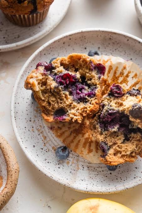 Soft, fluffy crumb structure with pockets of warm fruit, AI generated