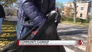 College students cleaning up in their community