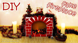 Christmas hacks christmas deco cardboard fireplace office christmas cheap christmas diy holiday diy christmas holidays diy cardboard christmas fireplace. How To Decorate Your Fireplace For Christmas