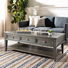 Simple yet stylish, this round coffee table adds a minimalist, natural vibe to any room. Safavieh Manelin Rectangular Wood Coffee Table With Storage Drawers Black Tinted Finish Amh6642c Rona