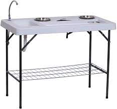 Store pots and dirt under it, pot up seeds and plants atop it, and use the faucet for. Amazon Com Outsunny 50 L Folding Fish Cleaning Table With Sink Faucet And Accessories Sports Outdoors