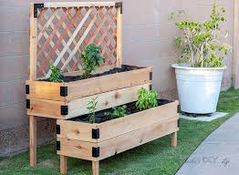 Smooth the edges with sandpaper and then fill the planter box with soil. Diy Tiered Raised Garden Bed Anika S Diy Life