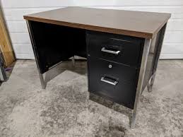 The most common oak and black metal desk material is metal. Small Black Metal Desk With Dark Walnut Top And Drawers