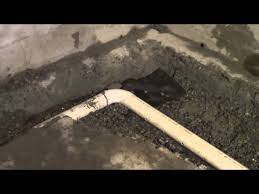 Away from the exterior of the foundation on all sides and installing drain tile (a flexible perforated pipe covered with mesh. How To Do A Interior Perimeter Drain Youtube
