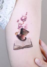 Tattoo tagged with small micro curiouser tiny white. Awe Inspiring Book Tattoos For Literature Lovers Kickass Things Bookish Tattoos Tattoos For Lovers Wonderland Tattoo