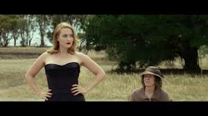 A glamorous woman returns to her small town in rural australia. The Dressmaker 2015 Official Trailer Kate Winslet Liam Hemsworth Youtube