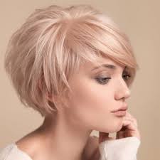 The wedge cut on curly hair with layers for movement complements a round face shape. 50 Wedge Haircut Ideas For A Retro Or Modern Look Hair Motive