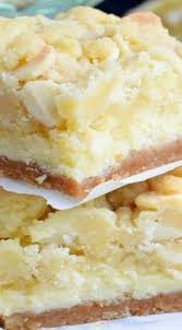 Lemon Cheesecake Bars Layers Of Cookie Crust Lemon Cheesecake And Lemon Cookie Bars One Of The Most Del Lemon Cookies Lemon Recipes Lemon Cheesecake Bars