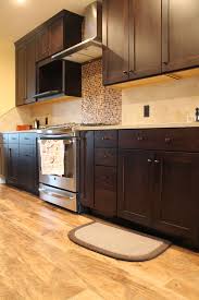 Traditional Kitchen Design Dark Maple Cabinets And Vinyl Plank Floors Traditional Kitchen Design Kitchen Flooring Industrial Kitchen Design