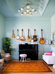 10 Ways To Decorate With Guitars That Would Make Taylor Swift Proud Home Music Rooms Retro Home Decor Wall Decor Living Room