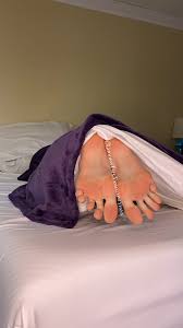 Some sleepy feet in bed - FeetPlaza