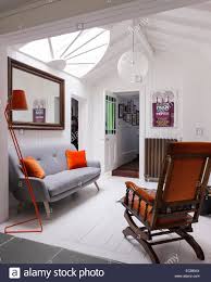 Check out our range of sofa suites to find the seating solution that's right for your space, your look and how you like to lounge around. Grey War Sofa Von Laib Mit Orange Samtkissen Am Landeplatz Mit Orange Stehleuchte Und Grosse Fangemeinde Licht Stockfotografie Alamy