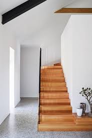 A Cosy Country Farmhouse With Modern Interiors Photography By Anson Smart Styling By Jono Fleming Staircase Decor Timber Staircase Polished Concrete Flooring