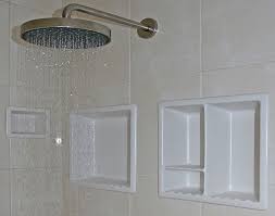 Installing porcelain fixtures is a smart way to achieve a clean bathroom design. Shower Niche Under Shower Head Do Able Shower Shelves Shower Niche Shower Remodel
