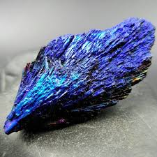 You Flow Like A Feather In A Beautiful World Take Your Breath Away With This Beautiful Titanium Enhanced Black Kyanite Feather Crystal This Gorgeous Specimen Ex Rainbow Aura Raven Feather Blue And Purple