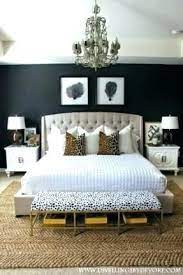 Worlds away alden cabinet beside a black poster bed with gold pillows and striped bedding a girl's bedroom illuminated by a set of antique brass swing arm sconces. Grey Black White Bedroom Black And Gold Bedroom Black Gold Grey Bedroom White Bedroom With Gold Accents B Gold Bedroom Grey And Gold Bedroom Gold Bedroom Decor