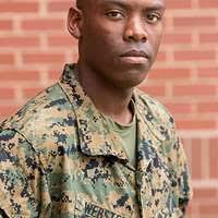 U.S. Marine Corps Staff Sgt. Dustin T. Spivey stands