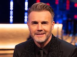 Gary Barlow's son Daniel towers over him in ultra rare family photo