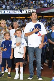 The dodgers compete in major league baseball (mlb). A New Los Angeles Dodgers Owner Honors His Immigrant Father Time