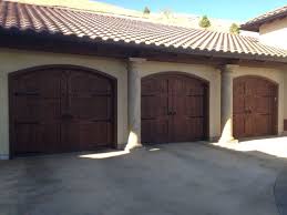 When designing a custom garage door in the spanish colonial style we use elements such as decorative iron clavos, rustic woods such as alder, rough cedar and other wood species that we distress to capture the glamour of the historic spanish colonial styles. Garage Door Repair Meridian Id Garage Doors Id