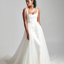The necklace has a lobster claw closure and has an attached slip knot at the bottom to hold it in place, making it easy to slip on and off and can be worn with a bow or tied on the other end of the dress. 20 Best Overskirt Wedding Dresses Of 2021
