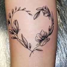 Flower wreath with heart shape are you ready to get inspired and find that one tattoo idea that will make your heart beat faster? Cute Heart Tattoo Ideas Popsugar Love Sex