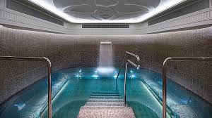 Incredible Indoor Pool With Shear Water Water Feature And A Stainless Steel Bench Seat Wrapping Around The Perimeter Pinned Spa Interior Spa Pool Spa Retreat